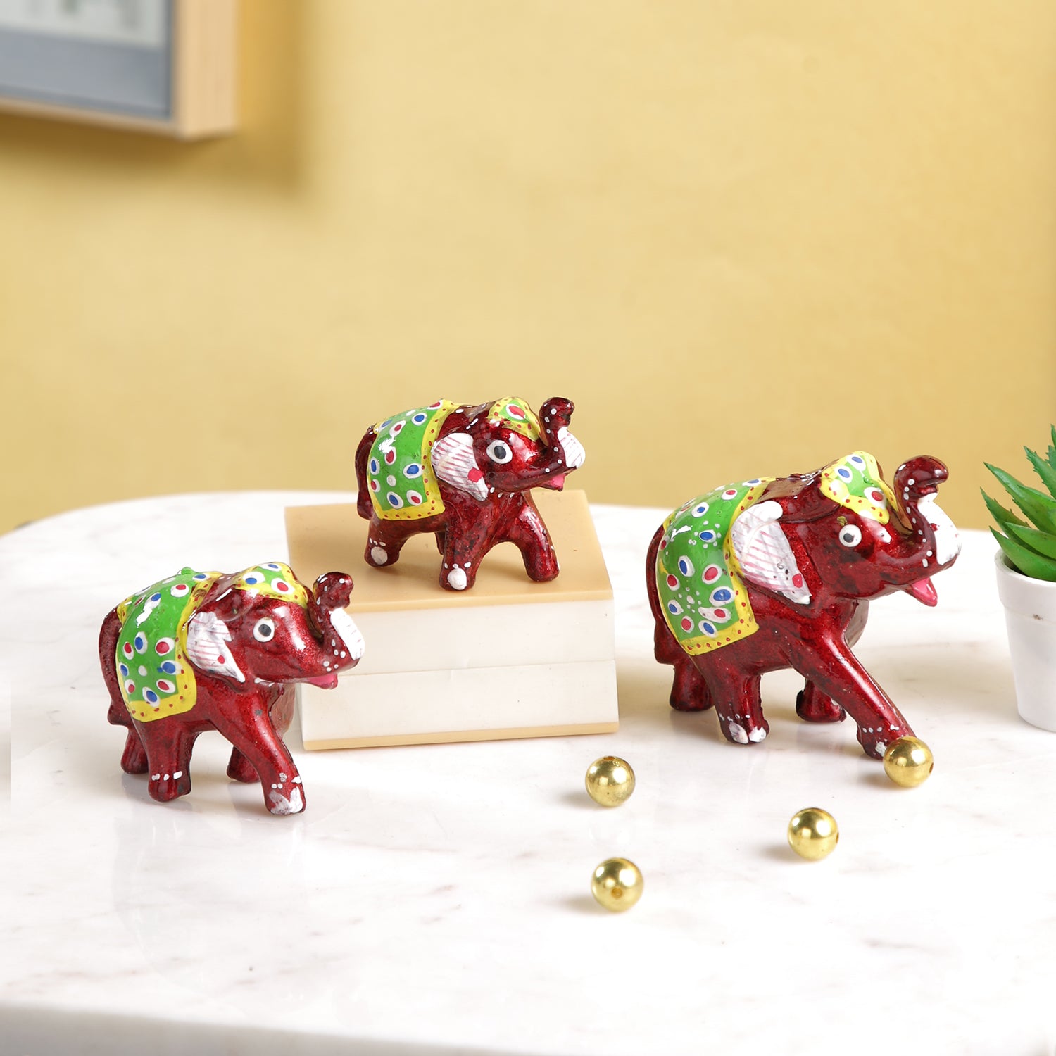 Miniature Colorful elephant family Trunk up